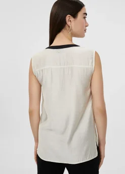 Top bicolor con aberturas