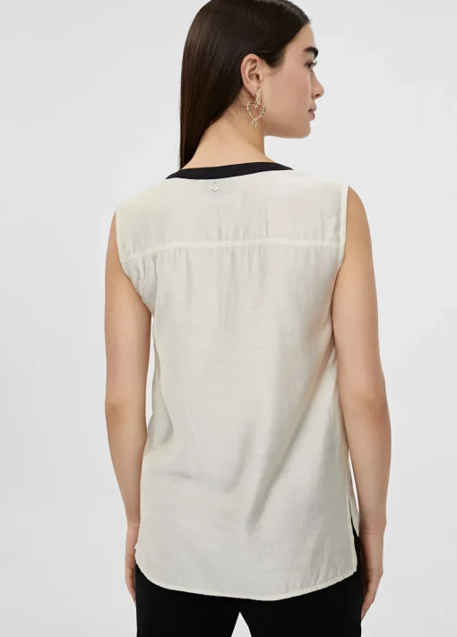 Top bicolor con aberturas