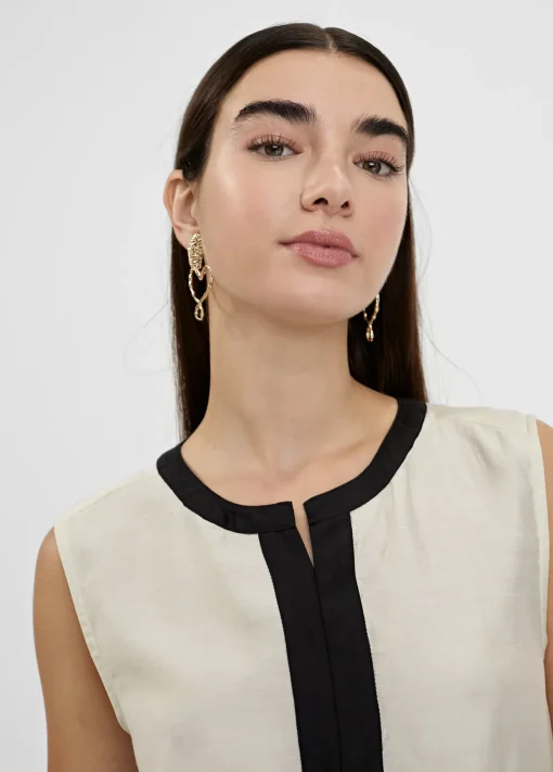 Top bicolor con aberturas